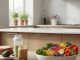 Bowl of fresh fruits and vegetables in a modern kitchen